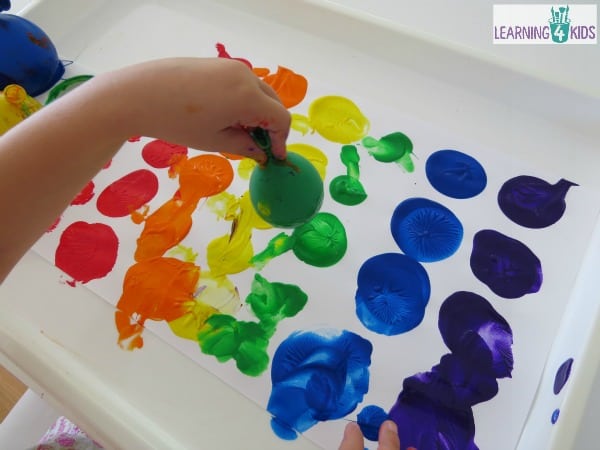 Easy Toddler Painting Project With Paint Sticks and Toys